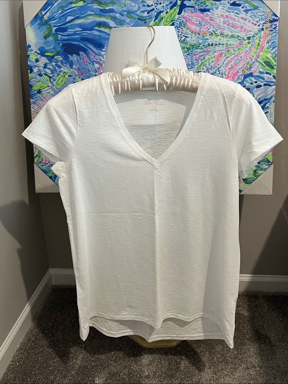 Lilly Pulitzer white v-neck tee.
Medium